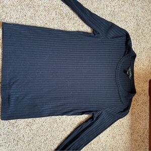 Black long sleeve. Fits tighter. Ribbed
